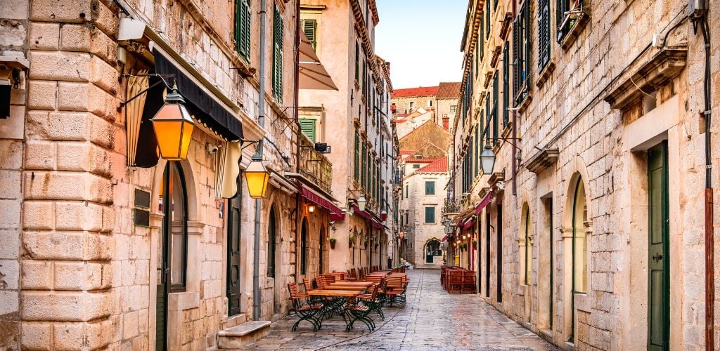 Dubrovnik, Croatia - Stradum old street view lined with traditional buildings and seating
