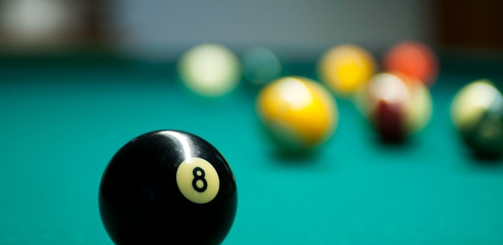pool table with 8 ball in focus 